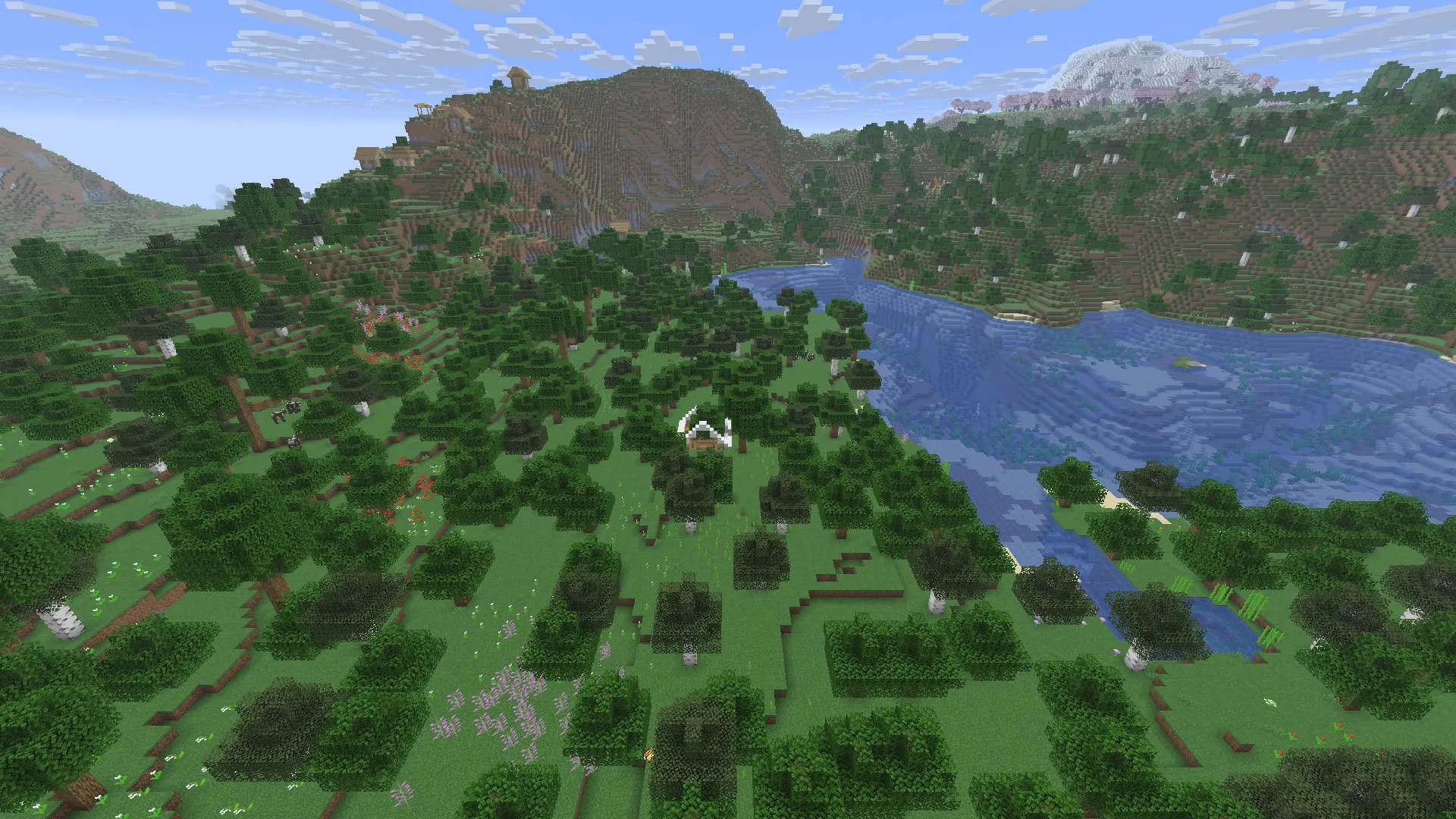 An open white tent in a forest clearing with flowers, a lake to the right and a wooded mountain behind. In-game screenshot, Java 26.3.
