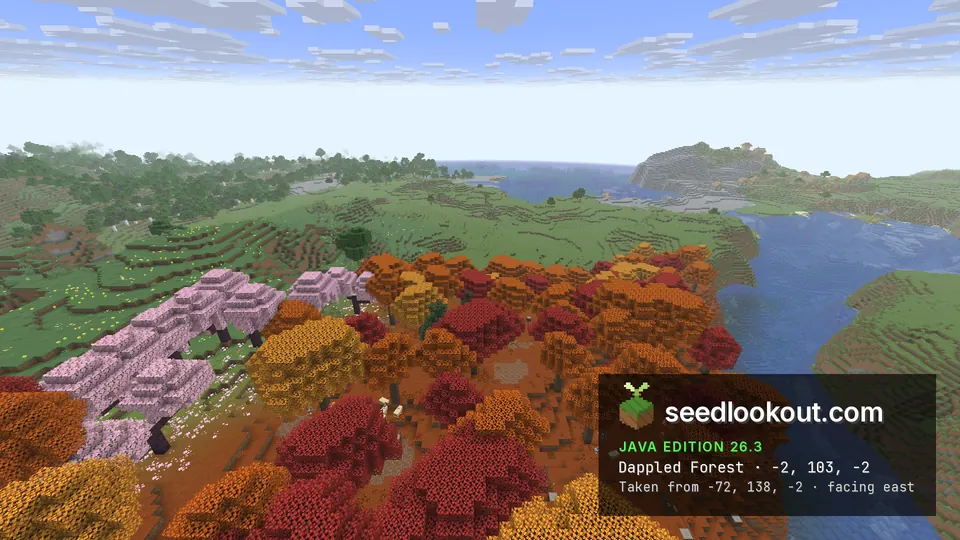 Red, orange and yellow dappled forest with a row of pink cherry trees, a river and grassy hills beyond