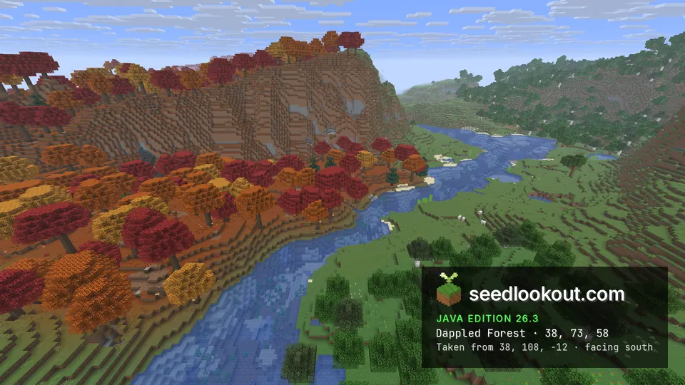 Red and orange trees on a steep slope above a winding blue river, with green forest on the right