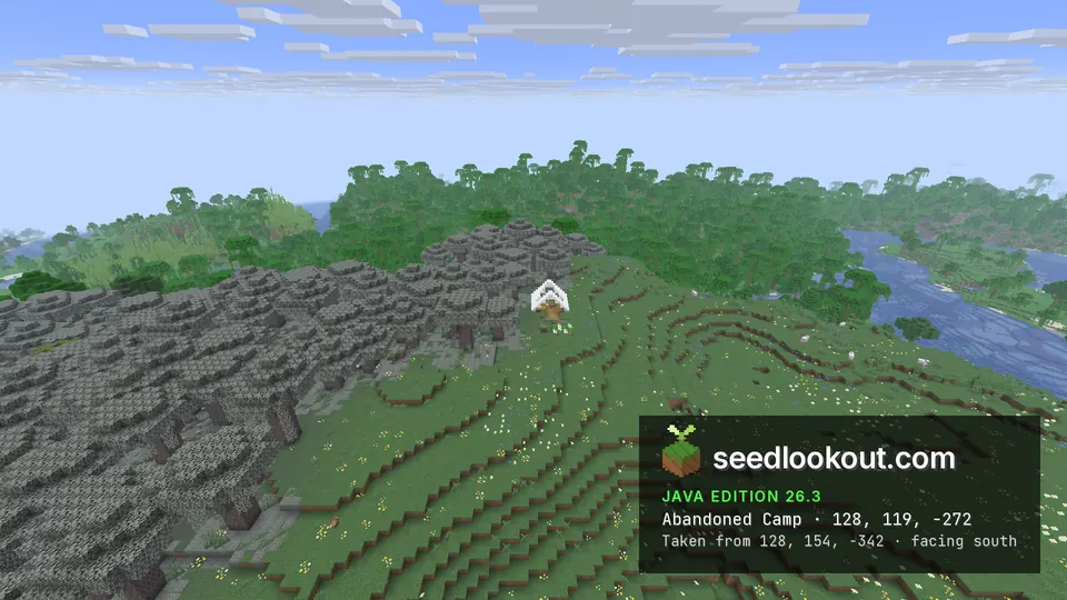 White tent on a flowery meadow ridge beside grey pale oak trees, with jungle and a winding river below