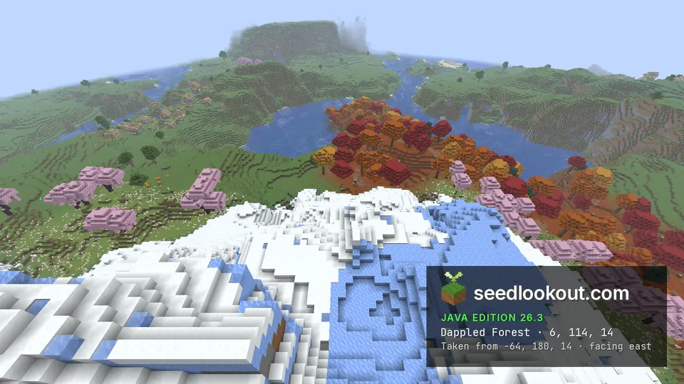 View east from a snowy slope over cherry trees and autumn-coloured forest to a lake and green hills