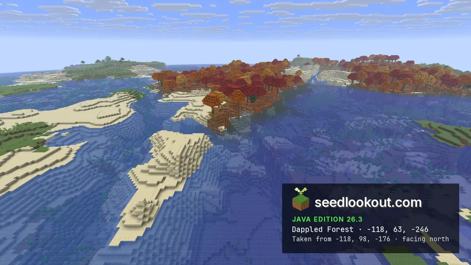 Band of red and orange trees across shallow water, with sandbars in the foreground